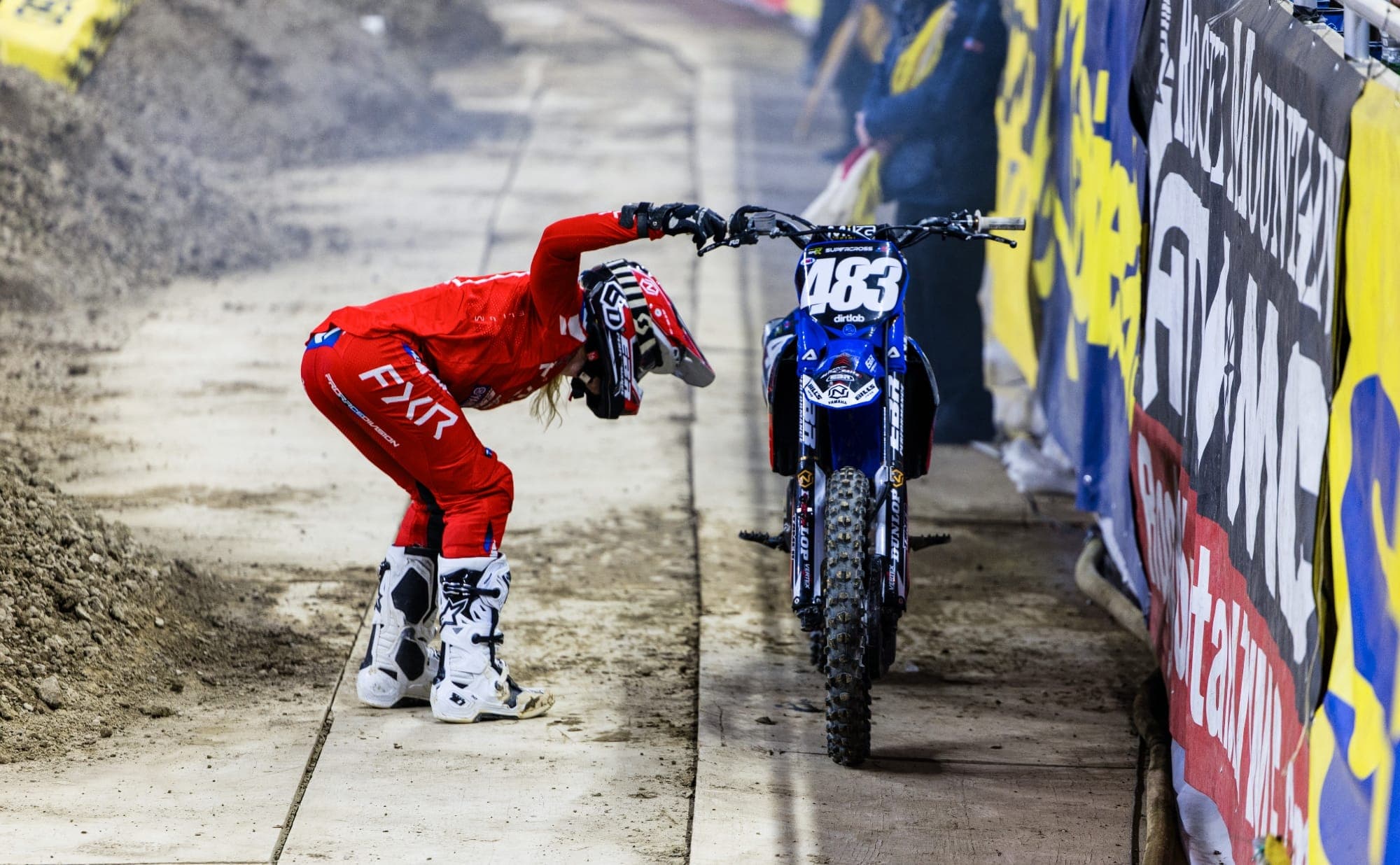 Bryton Carroll evaluates an engine failure at the 2025 Detroit Supercross.